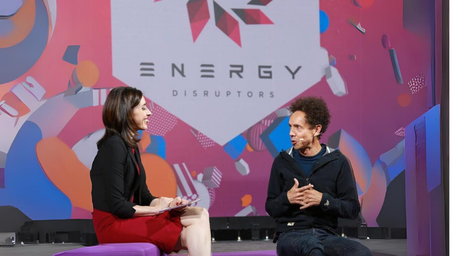 Holly Ransom interviewing Malcolm Gladwell on stage