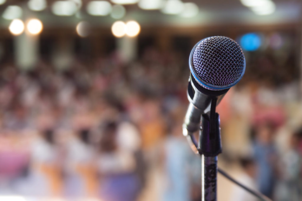 Microphone in front of an audience.