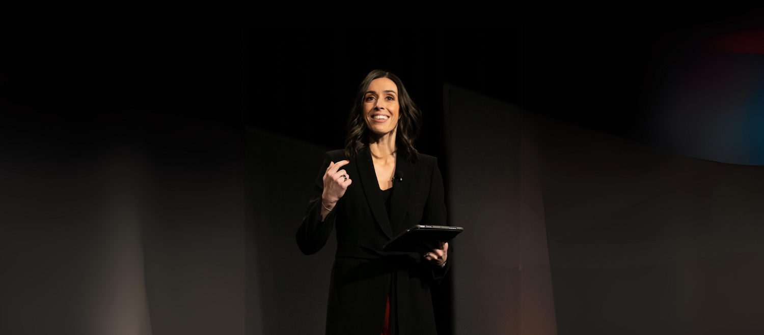 Holly Ransom hosting an event on stage