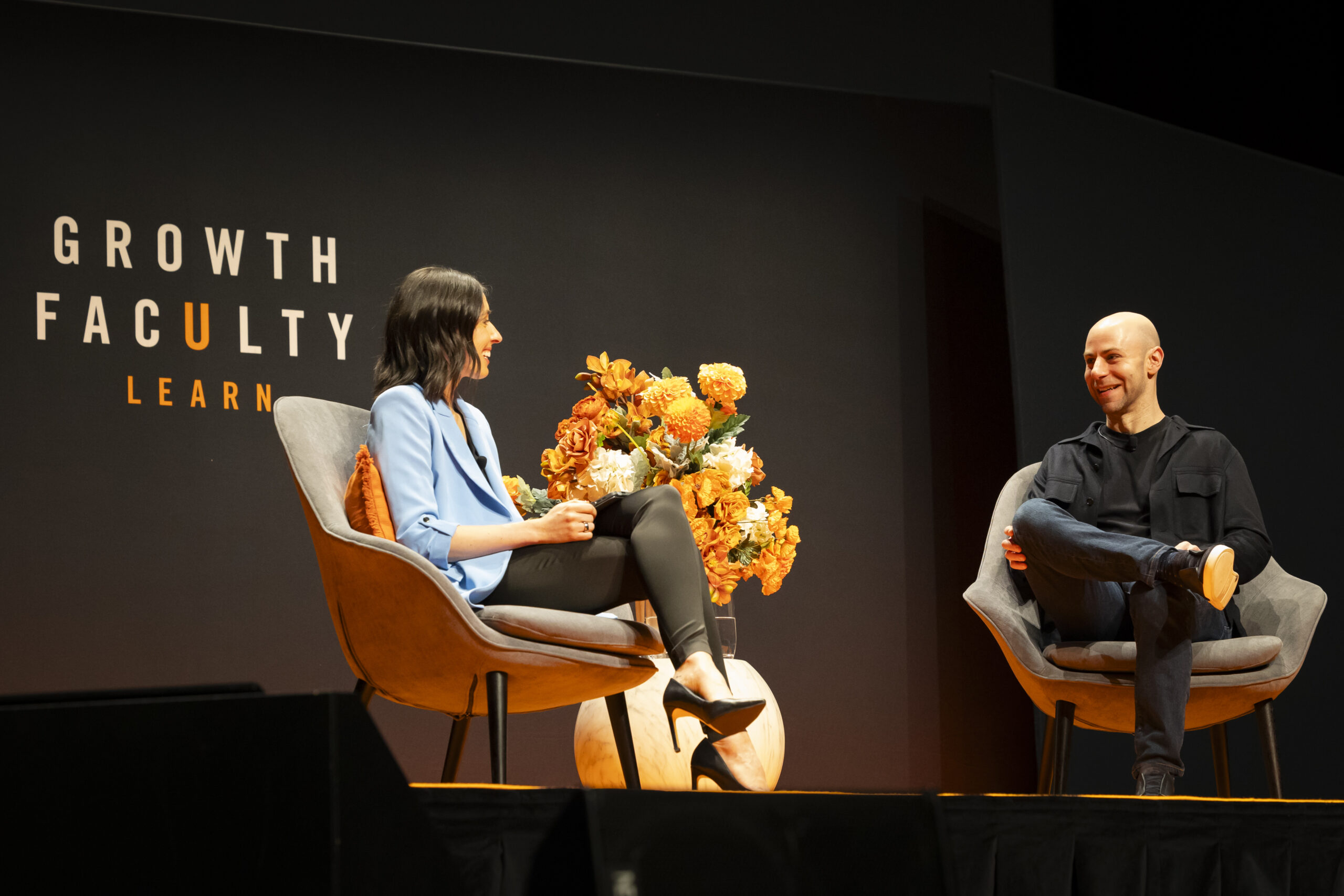 Holly Ransom interviewing Adam Grant on stage
