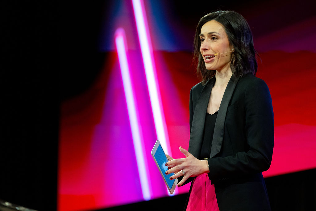 Holly Ransom emceeing ADMA Global Forum 2025, introducing a session on energy as a kpi